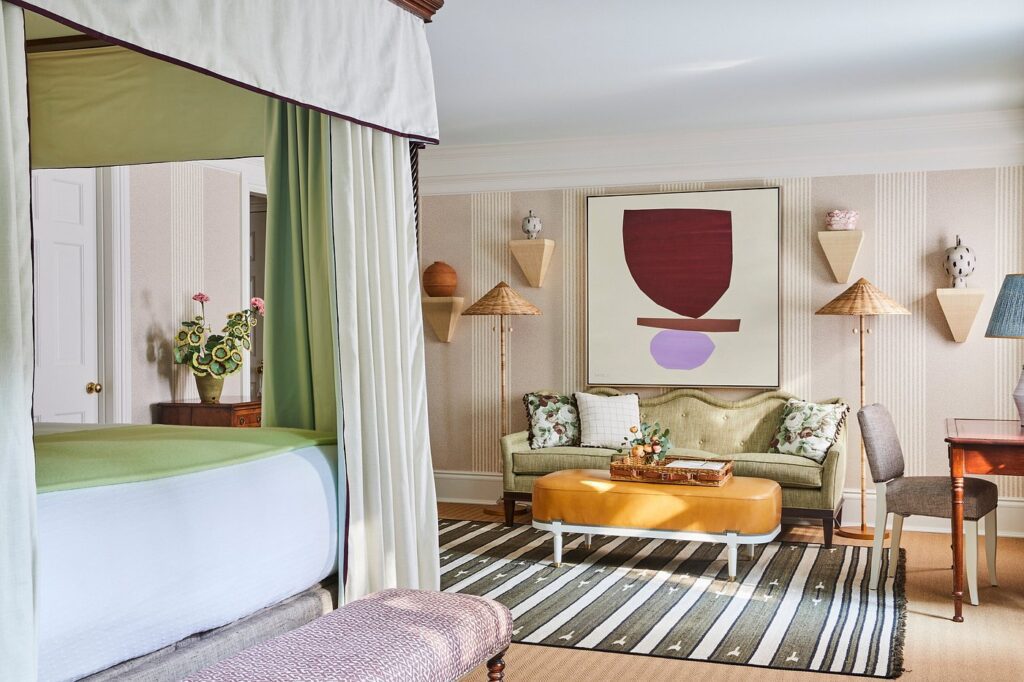Bright guest room at Mayflower Inn with French doors opening to a private terrace