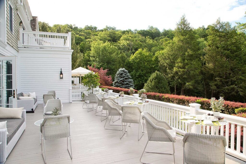 Scenic outdoor deck seating at Mayflower Inn overlooking the Connecticut countryside