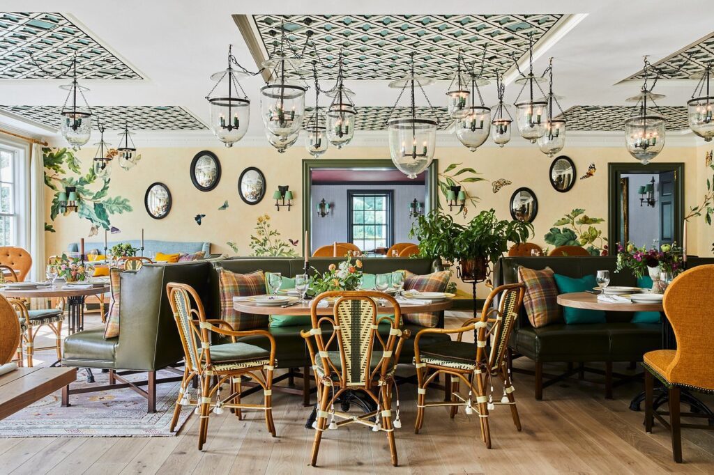 Light-filled dining room at Mayflower Inn with coastal-inspired décor and seasonal menu offerings