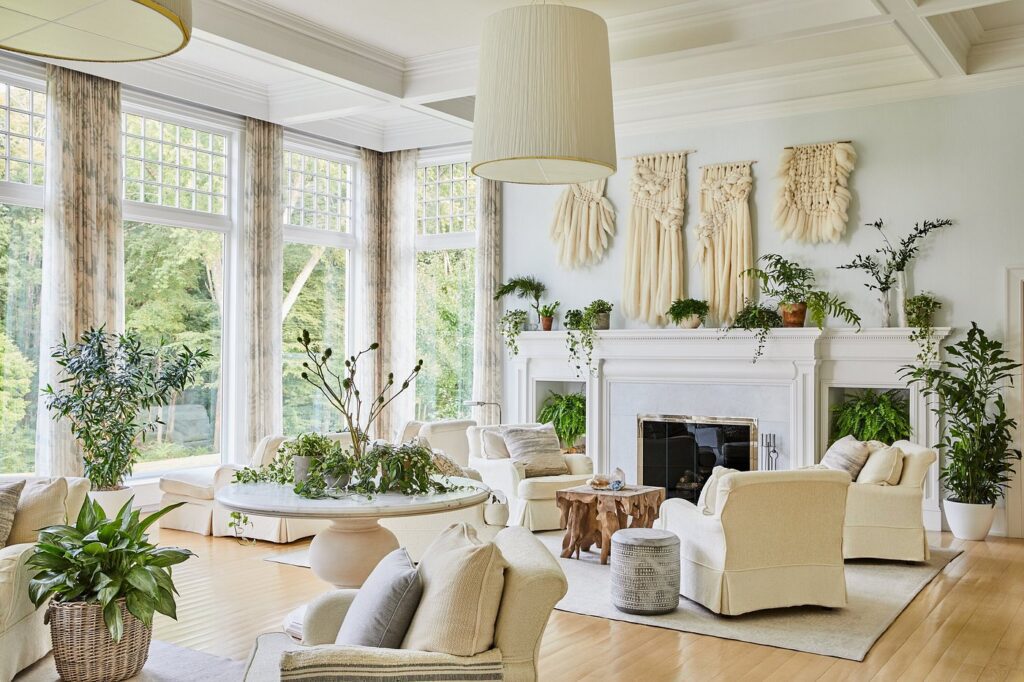 Sunlit lobby seating area at Mayflower Inn with plush white armchairs and elegant detailing