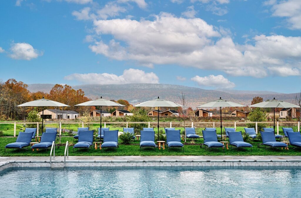 Serene outdoor swimming pool at Wildflower Farms with sweeping Hudson Valley mountain views